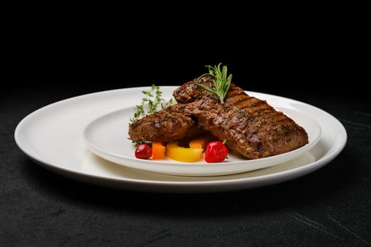 Two grilled steaks on a plate