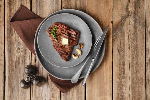 Overhead view of beef steak on a plate