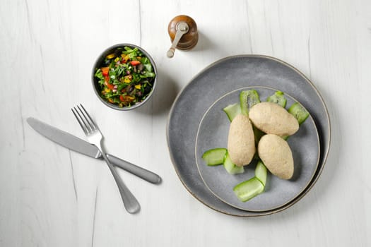 Top view of semifinished frozen cepelinai. Potato dumplings stuffed with ground meat.