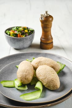 Semifinished frozen cepelinai. Potato dumplings stuffed with ground meat.