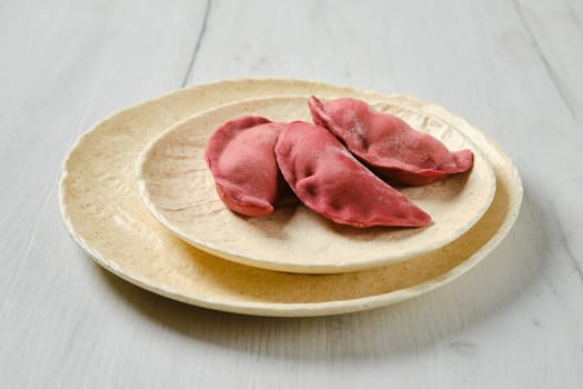 Concept of delivery of semifinished food. Sweet dumplings stuffed with cherry and frozen.
