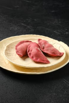 Concept of delivery of semifinished food. Sweet dumplings stuffed with cherry and frozen.