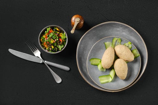 Top view of semifinished frozen cepelinai. Potato dumplings stuffed with ground meat.