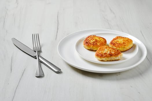 Fried squid cutlet in breading on a plate