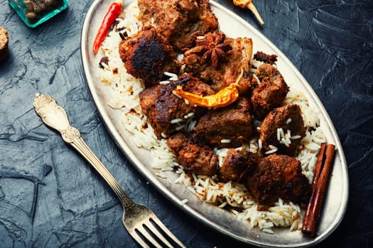 Vinegar marinated pork stewed in Indian spices, vindaloo.