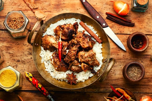 Vinegar marinated pork stewed in Indian spices, vindaloo.