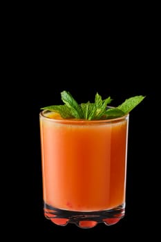 Hot red currant and orange winter drink with honey isolated on black