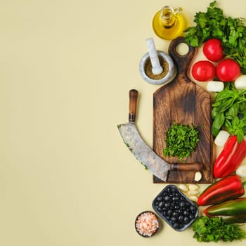 Top view of mezzaluna and ffresh vegetables. World vegan food day concept.