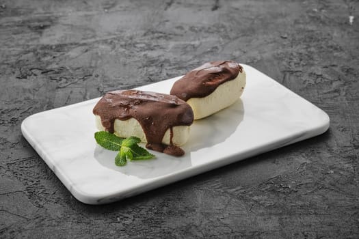 glazed curd with chocolate  on marble plate