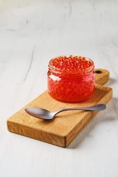 Open bowl with pink salmon red caviar