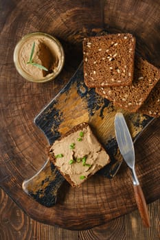 Overhead view of sandwich with wild deer liver pate, homemade rustic snack
