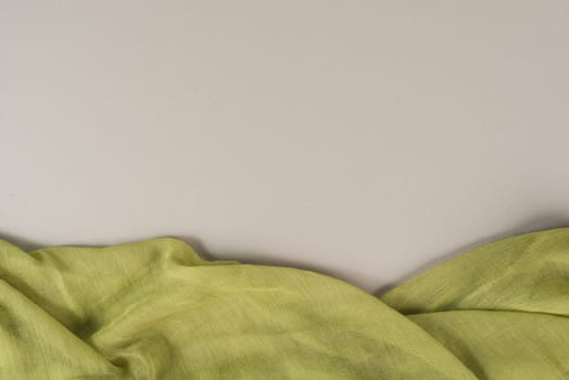 Background with a green colored woven cloth, copy space for text