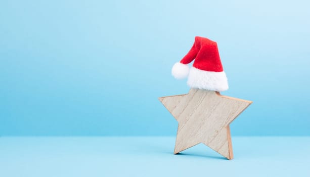 Star with a red christmas hat, winter greeting card and banner, copy space