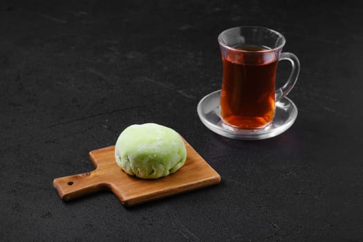 Sweet dessert mochi with kiwi with fruit tea