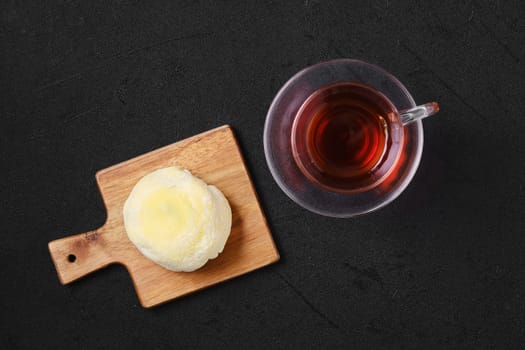 Top view of sweet dessert mochi with banana and chocolate with fruit tea