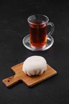 Sweet dessert mochi with coconut chips with fruit tea