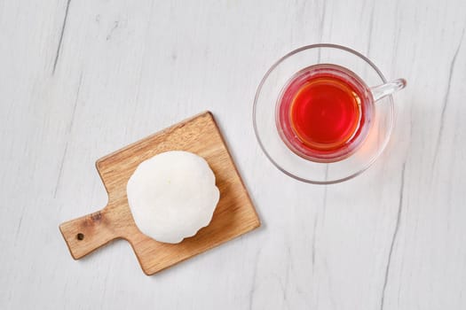 Top view of sweet dessert mochi with coconut chips with fruit tea
