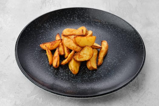 Garnish to the main dish - Slices of potato wedges fried in oil
