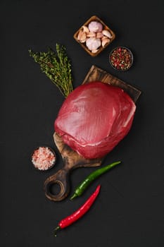 Top view of raw beef top round meat, whole uncut section