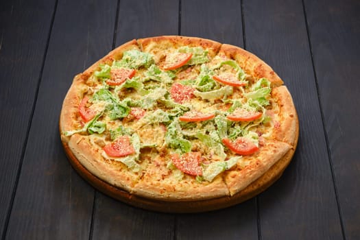 Pizza with squid, shrimps, parmesan and salad leaves