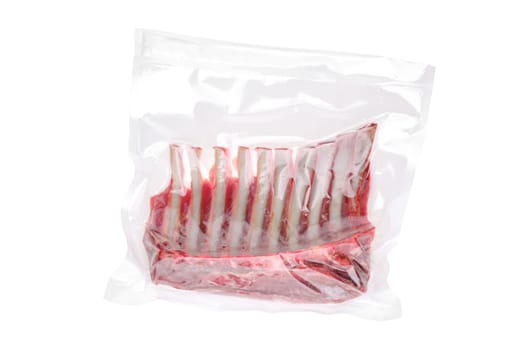 Vacuum sealed lamb ribs isolated on white