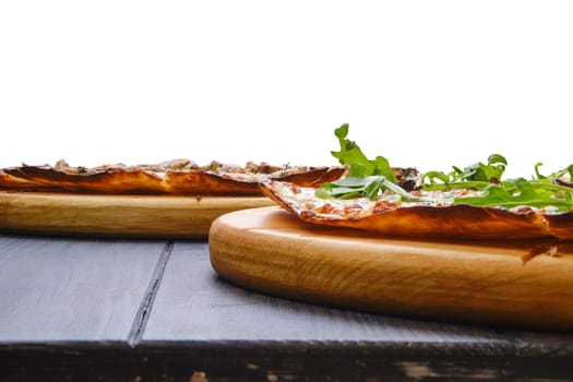 Pizza with minced meat, cheddar cheese and tomato and cream cheese inside the dough