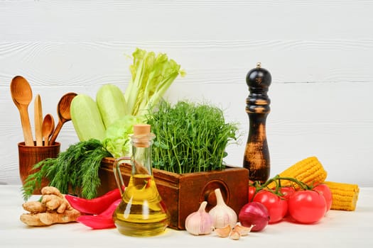 Wooden table with fresh eco vegetables and herbs. World vegan day concept with copy space for text.