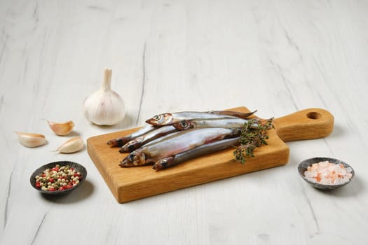 Pile of fresh raw frozen capelin