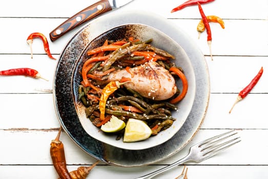 Delicious chicken legs stewed with asparagus beans and carrots.