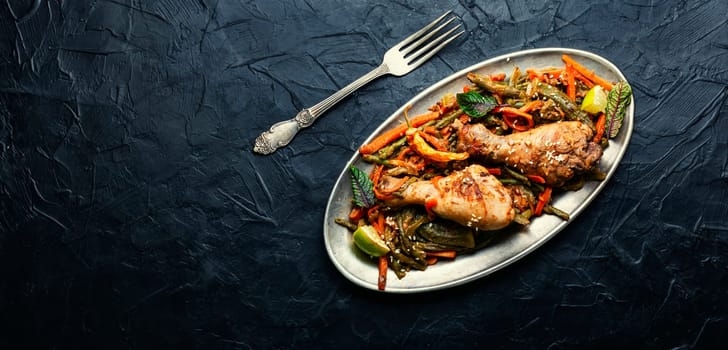 Delicious chicken legs stewed with asparagus beans and carrots.