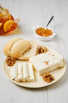 Healthy rustic breakfast. Homemade curd cheese with raisin and walnut