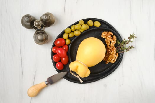 Overhead view of pulled scamorzza cheese on a plate