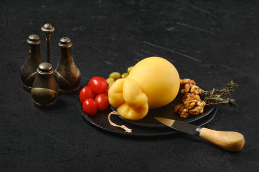 Delicious pulled caciocavallo yellow cheese on a plate
