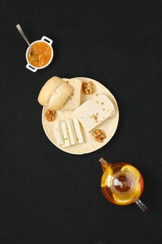 Healthy rustic breakfast. Homemade curd cheese with raisin and walnut, top view