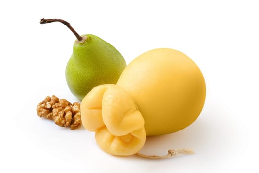 Pulled caciocavallo or scamorzza italian yellow cheese with pear and walnut isolated on white background