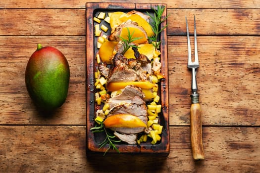 Delicious grilled meat with mango and cheese.