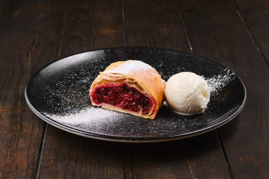 Piece of classic cherry strudel on a plate