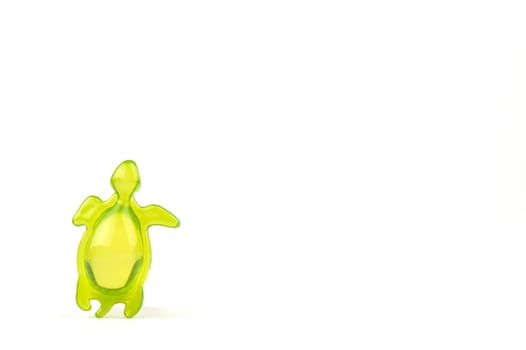 bath soap in the shape of a green tortoise, isolated on white background