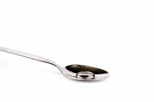 a spoon with drop, isolated on white background