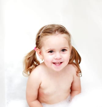 Small girl in bath tube