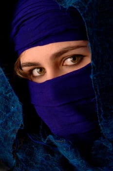 a beauty wrapped up in scarves