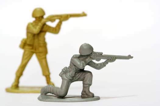 Toy soldiers firing their weapons.