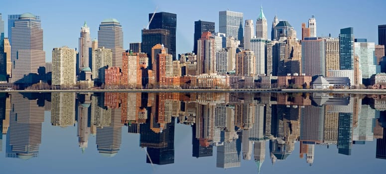 Panorama of Manhattan skyline with water reflection