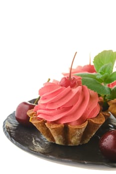 Fresh cherry cake isolated on white background (focus on berries)