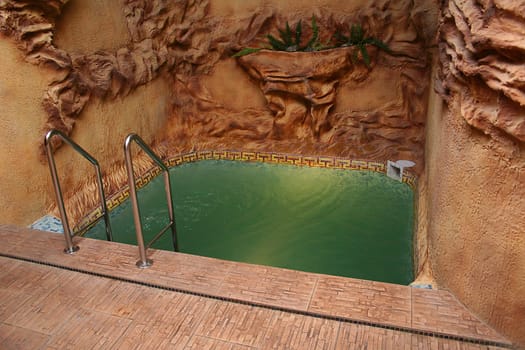 Small sauna pool with ladder and inner lighting