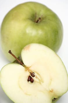 Two green apples on a white background