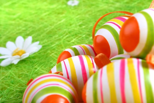Painted Colorful Easter Eggs on green Grass