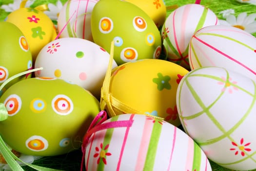 Painted Colorful Easter Eggs on green Grass