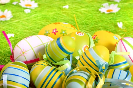 Painted Colorful Easter Eggs on green Grass