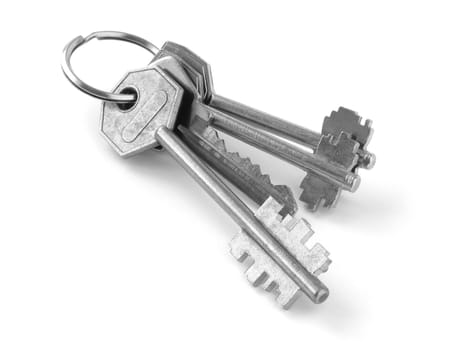 bunch of keys from door locks on white background
